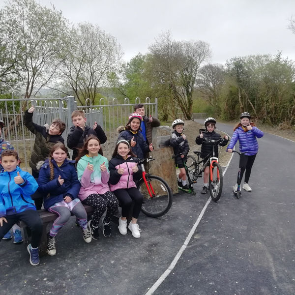 Comins Coch Primary School pupils giving the new shared use path a big ‘thumbs up’